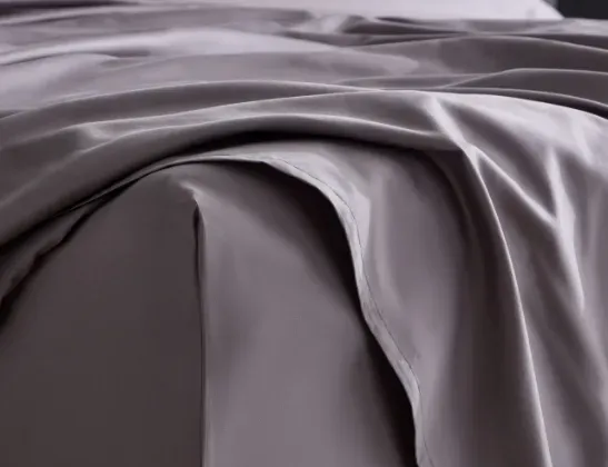 gray bed sheets close up